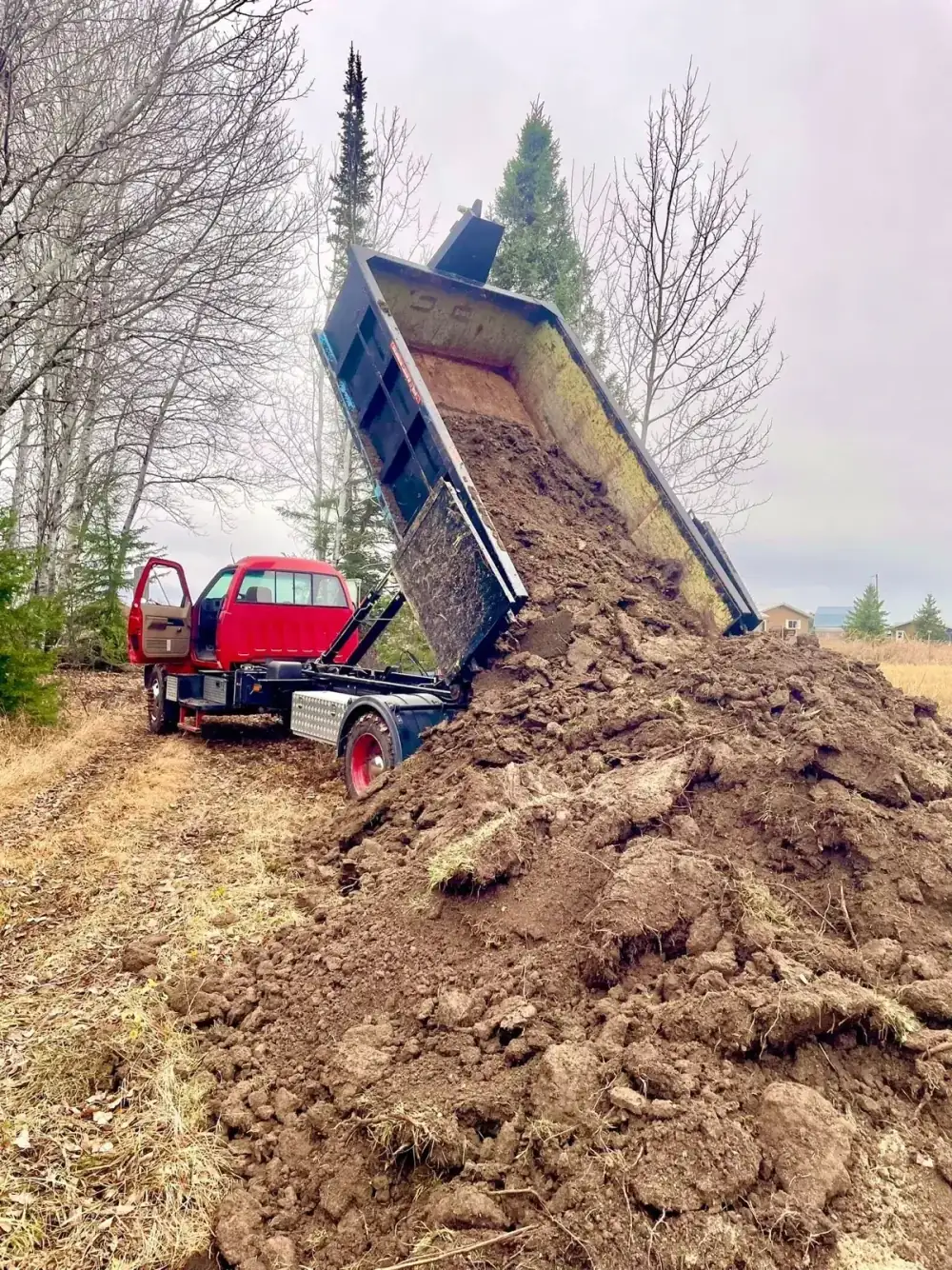 Dump truck unloading soil